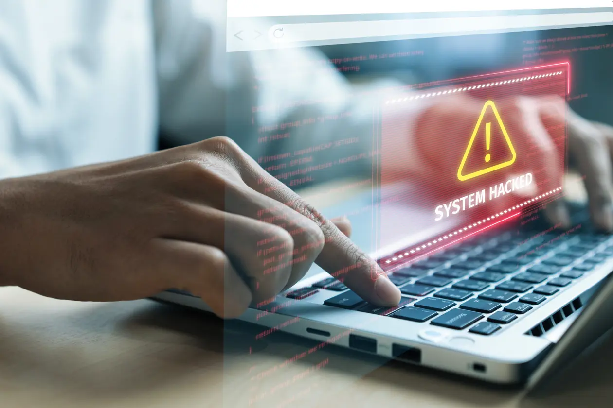 a person typing on a laptop