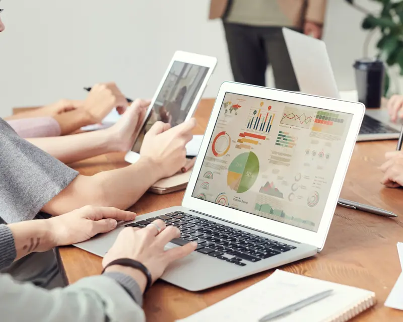 a group of people using laptops