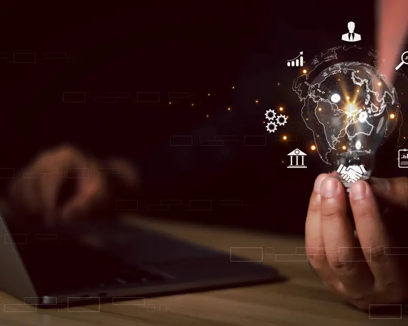 a person holding a light bulb