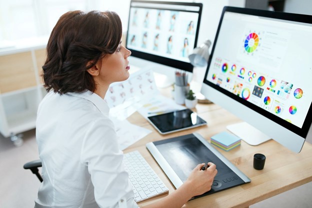 a woman using a graphic tablet