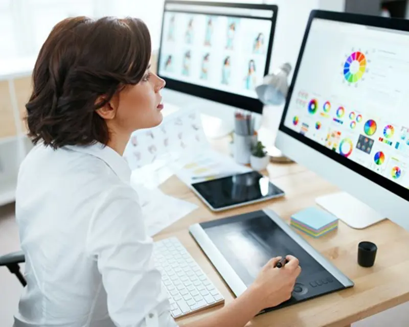 a woman using a graphic tablet