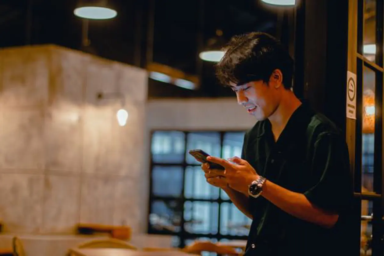 a man looking at a phone