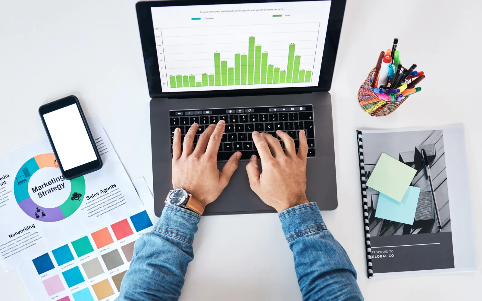a person typing on a laptop