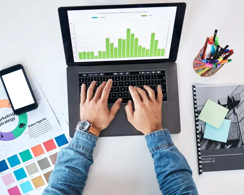 a person typing on a laptop