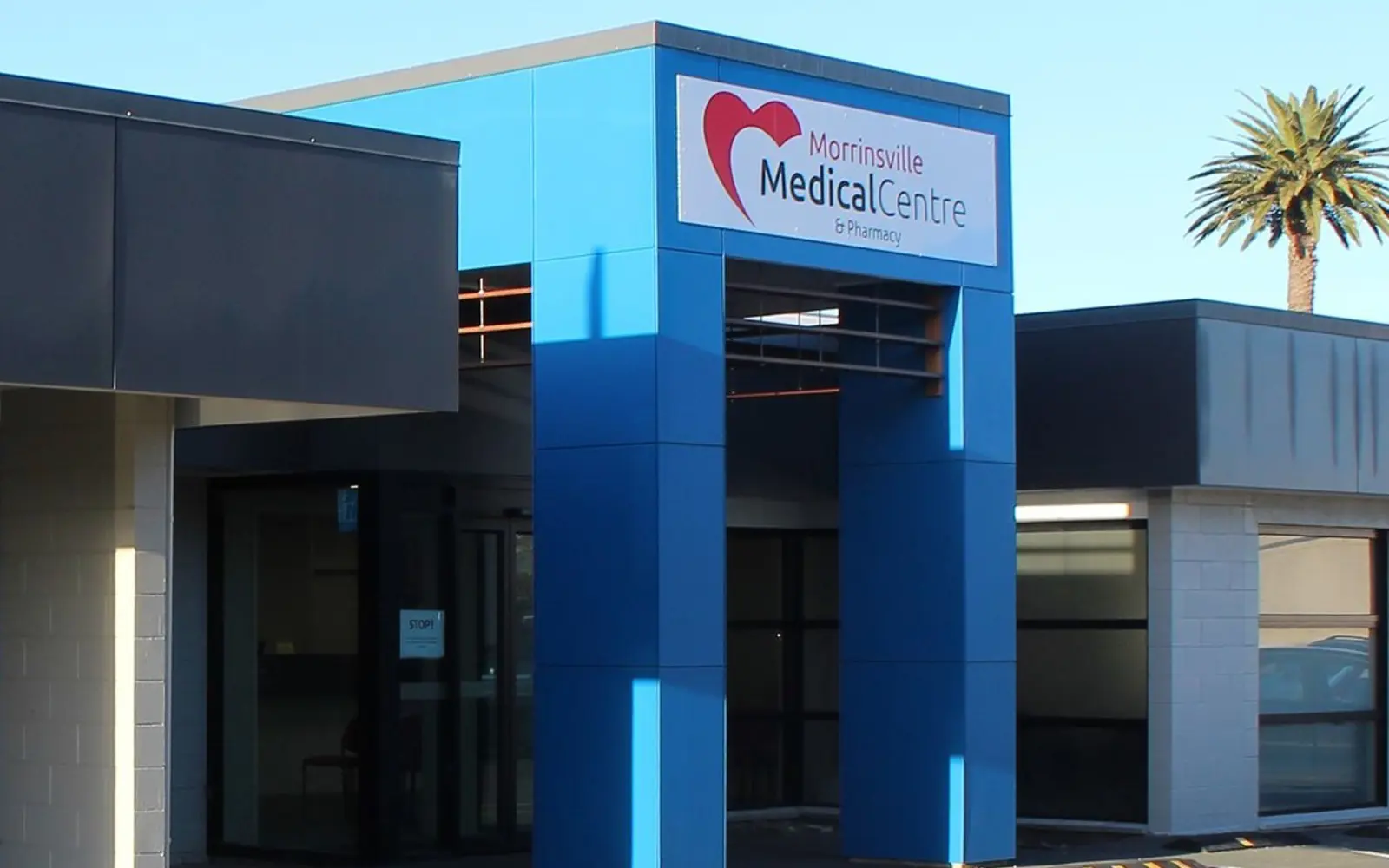 a blue building with a sign