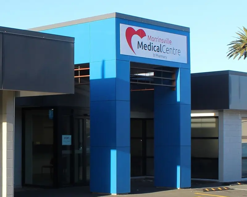 a blue building with a sign