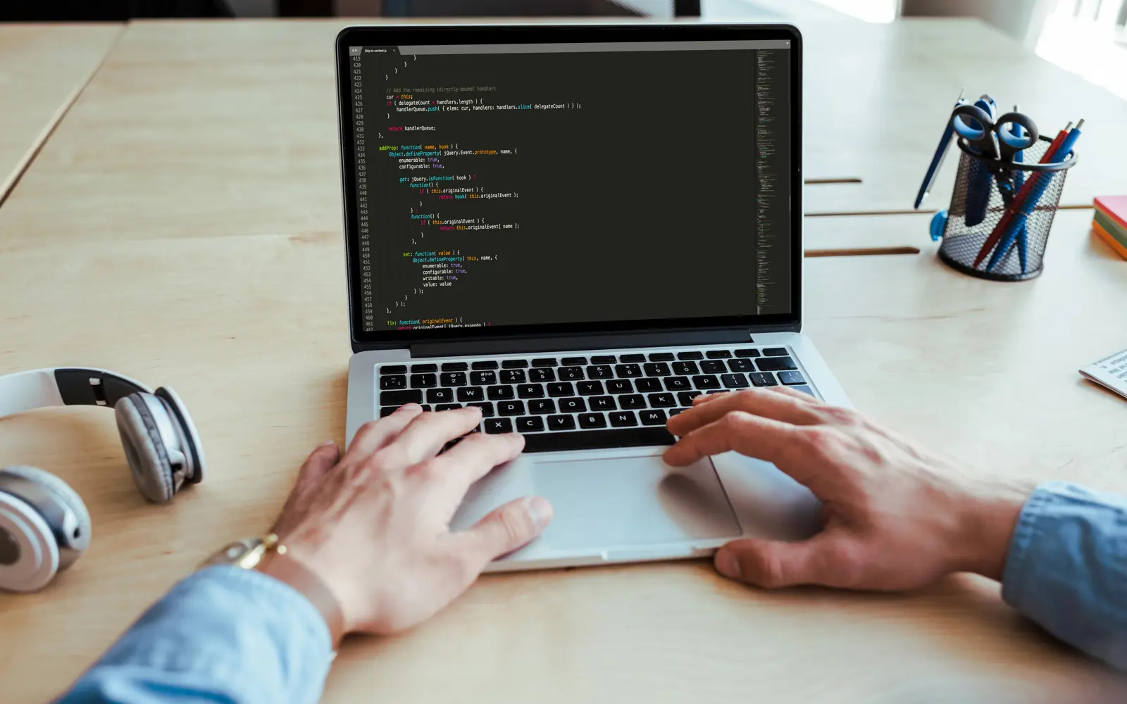 a person typing on a laptop