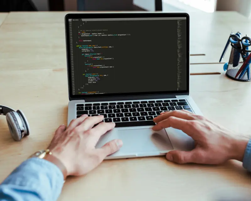 a person typing on a laptop