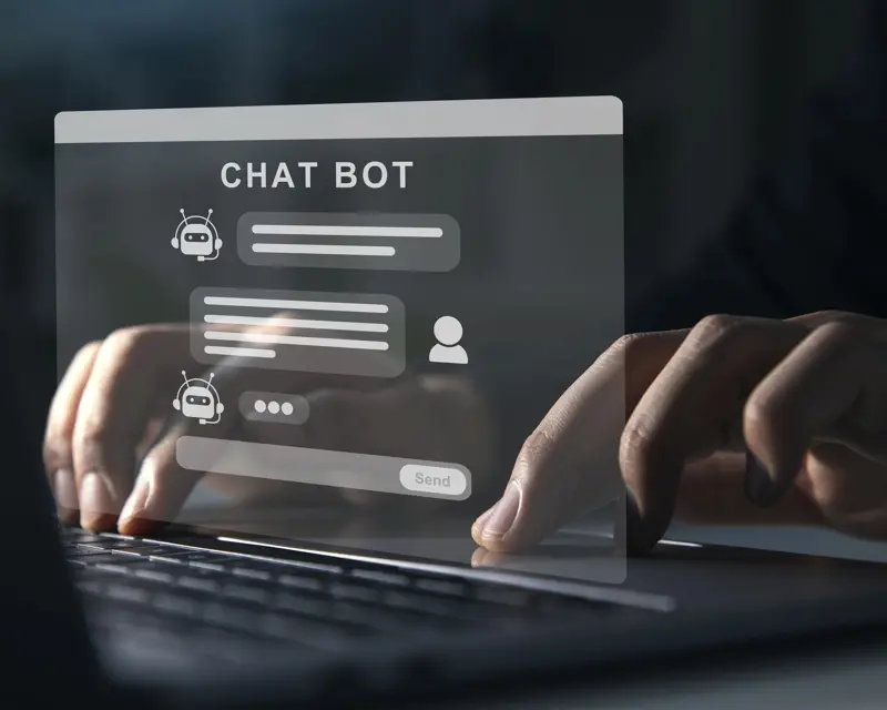 a person typing on a laptop