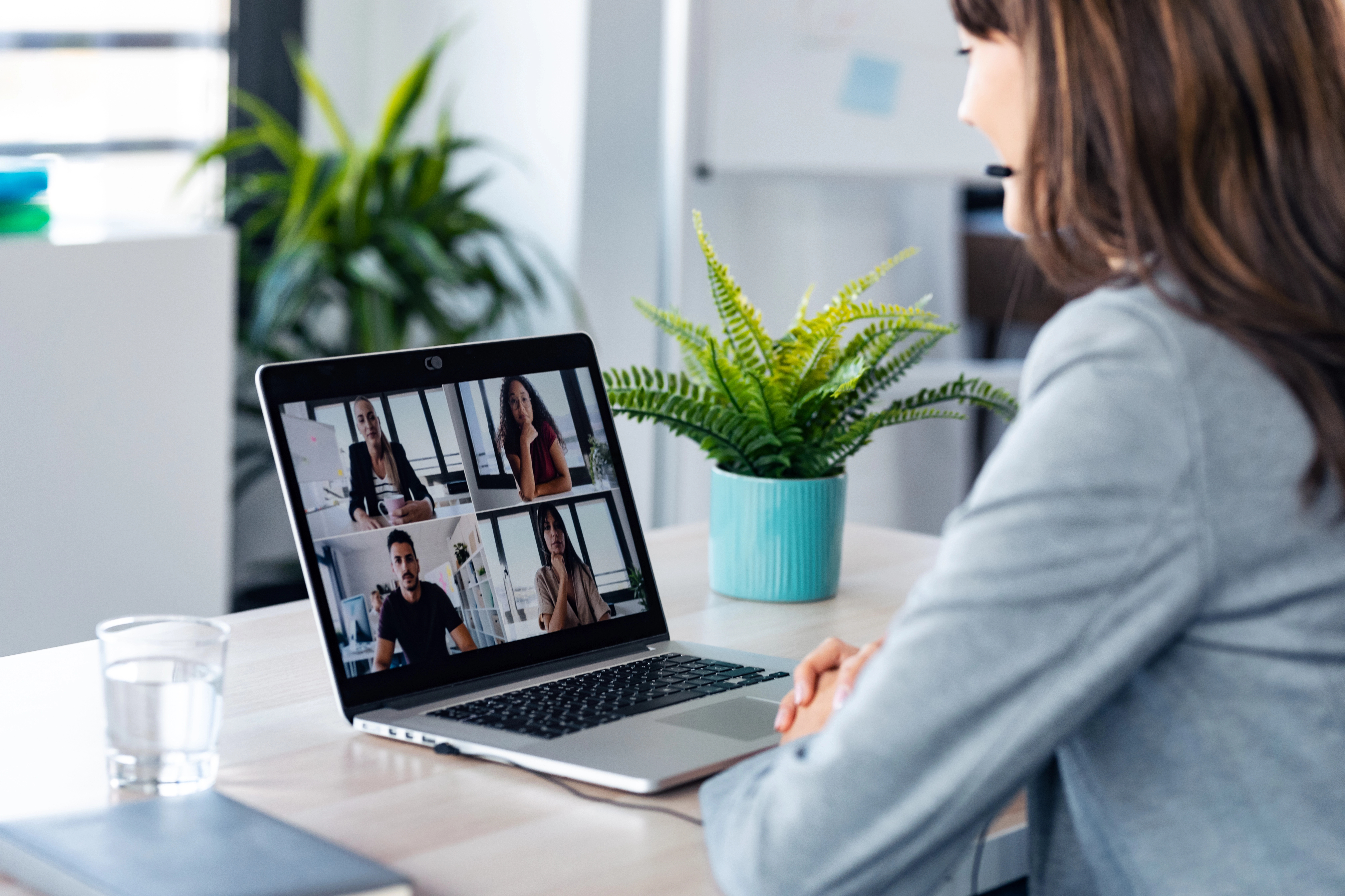 a woman using a laptop for a teams meeting