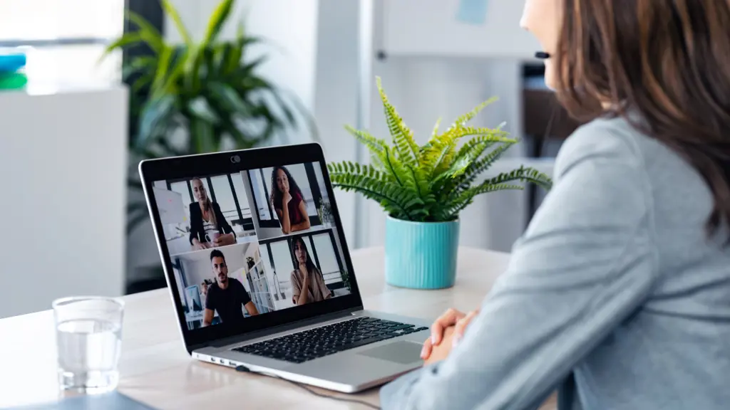 a woman using a laptop for a teams meeting