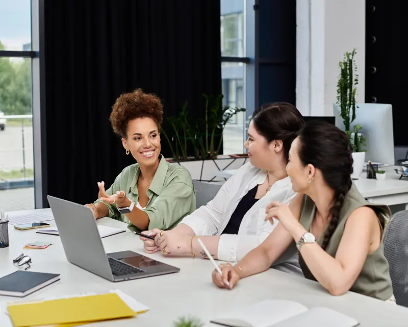 Team collaborating with a laptop