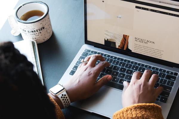 a person typing on a laptop