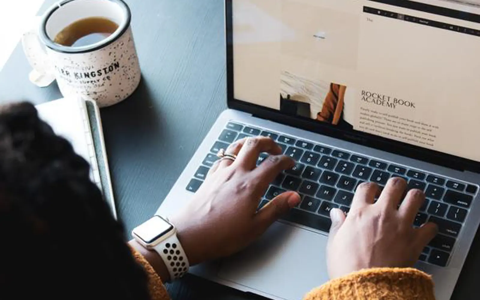 a person typing on a laptop