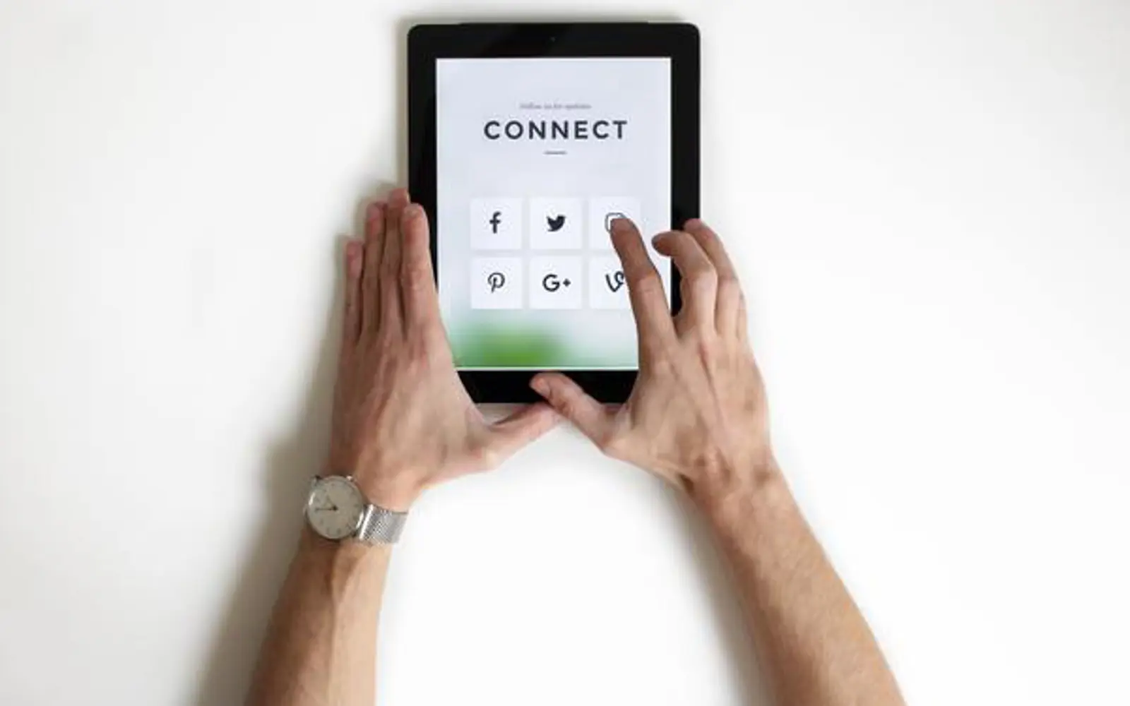 a person holding a tablet