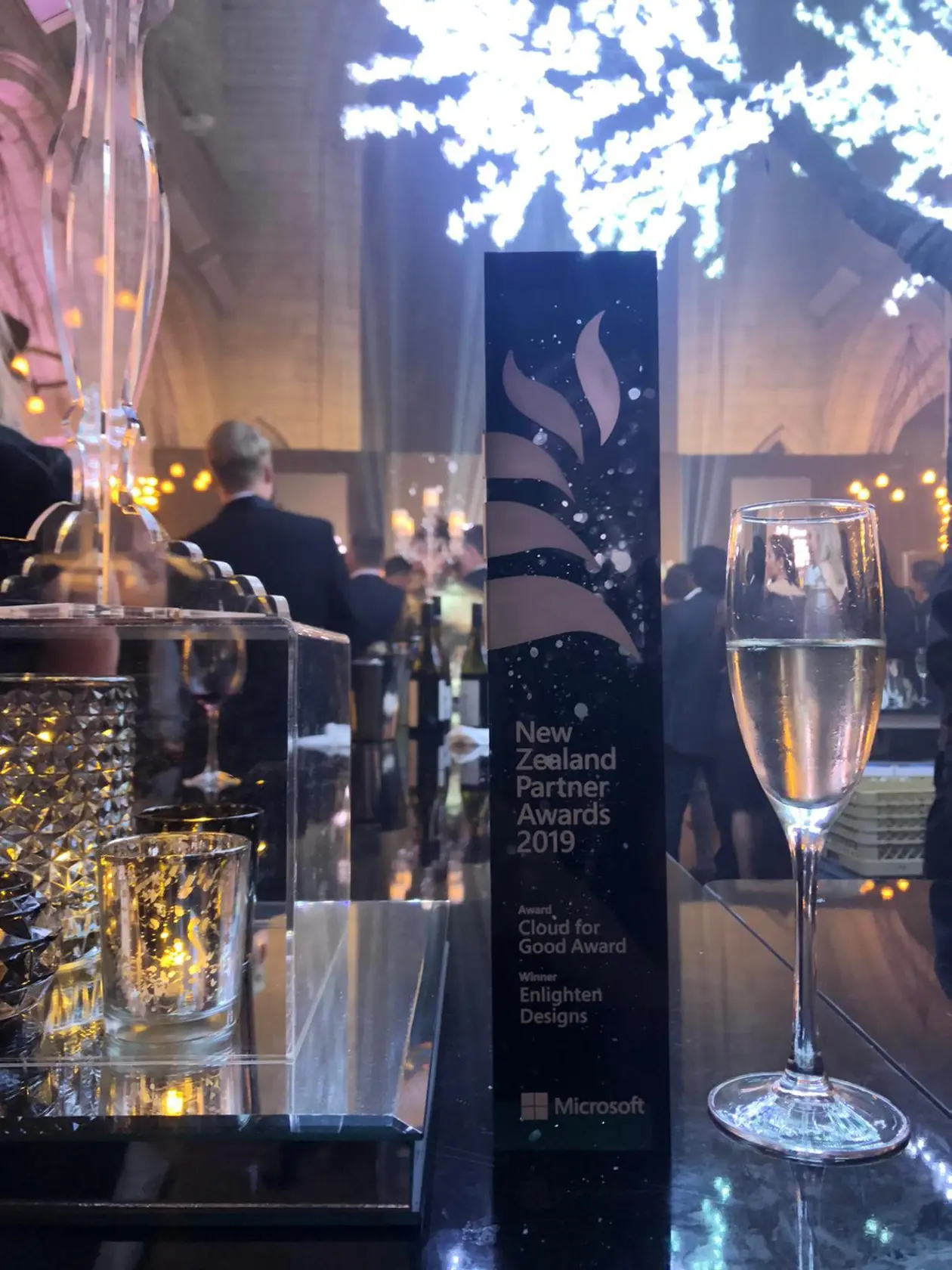 a glass of champagne next to a box