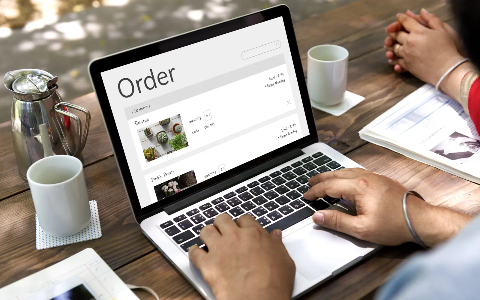 a person typing on a laptop