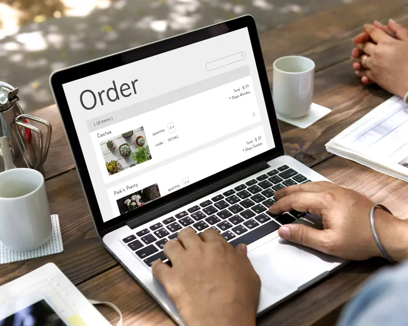 a person typing on a laptop